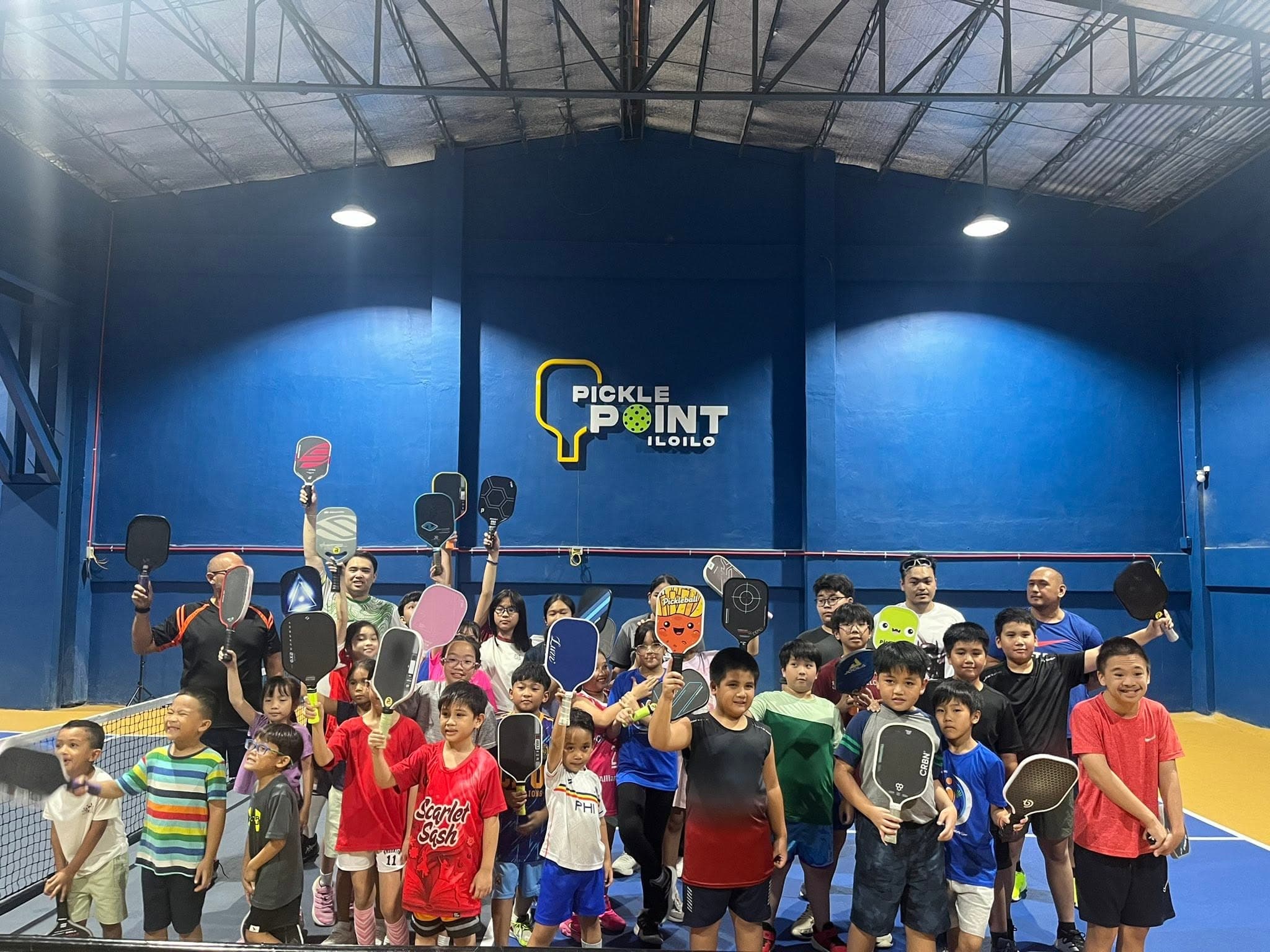 Players at PicklePoint net